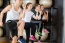 4 young people in an exercise class doing high knees